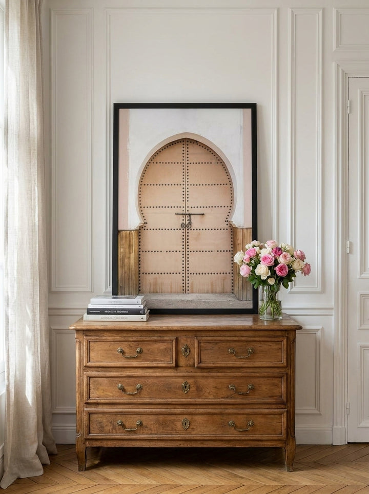 Modern wall art print standing on a sideboard in a Parisian living room
