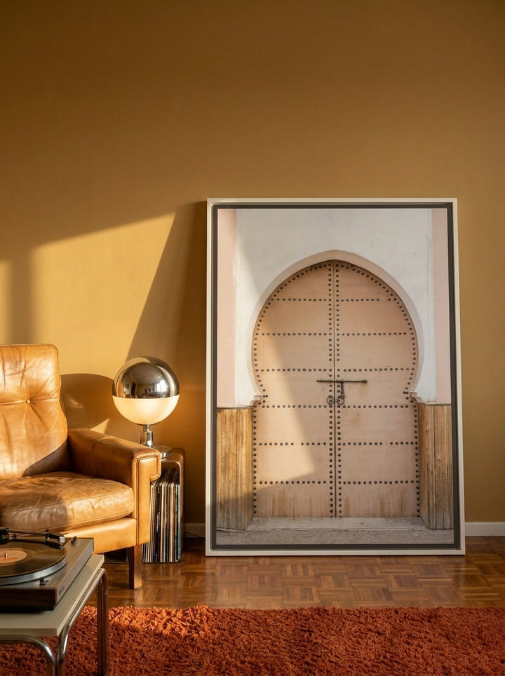 Canvas wall art with a white surround leaning against the wall in a retro 70s bedroom