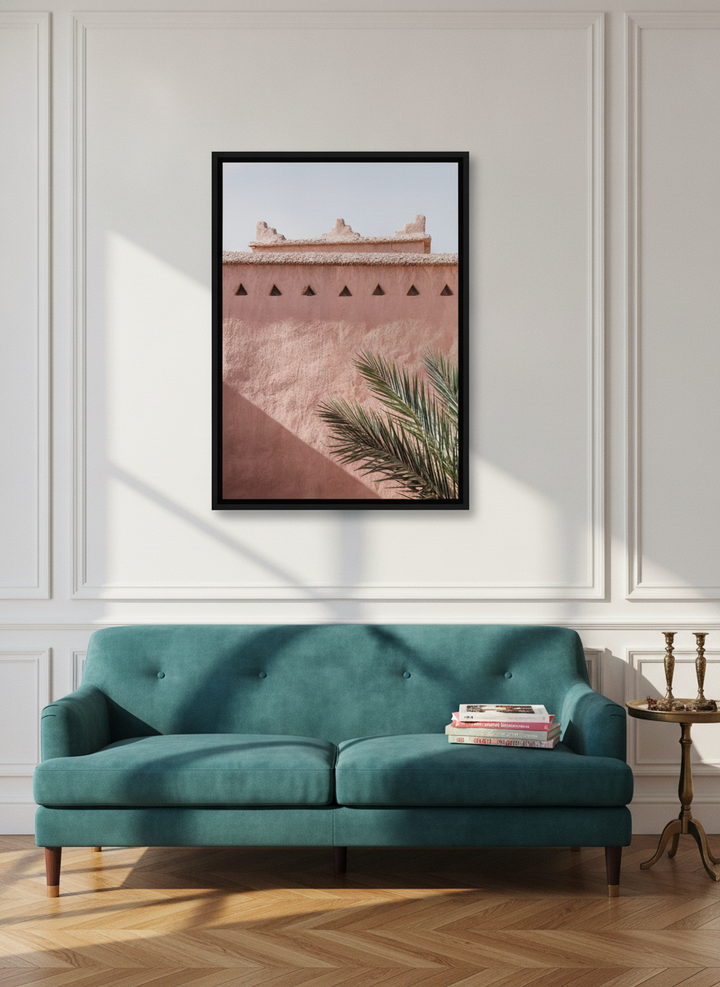 Canvas wall art with a black surround styled on the wall in a Parisian living room