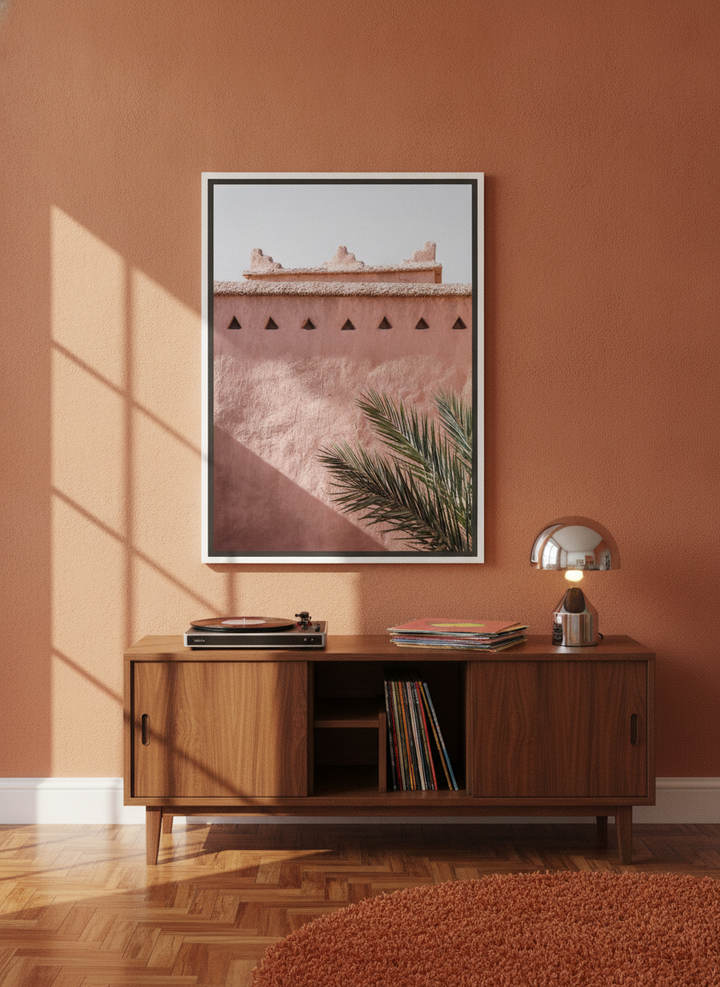 Canvas wall art with a white surround standing on a sideboard in a retro 70s bedroom