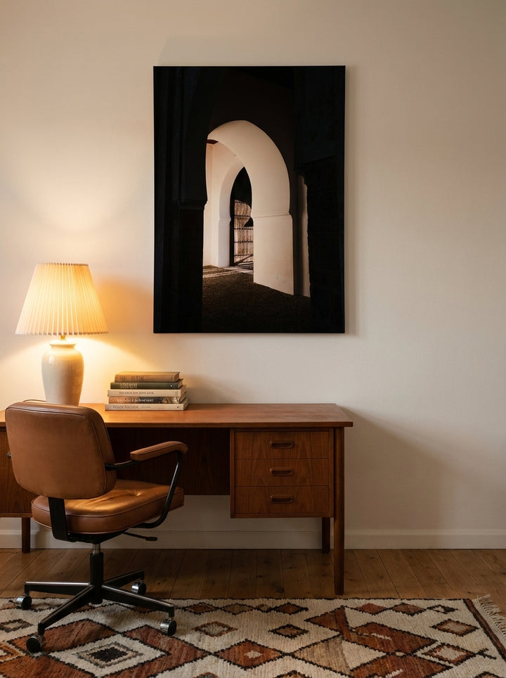 Stretched canvas wall art styled on the wall in a mid-century home office