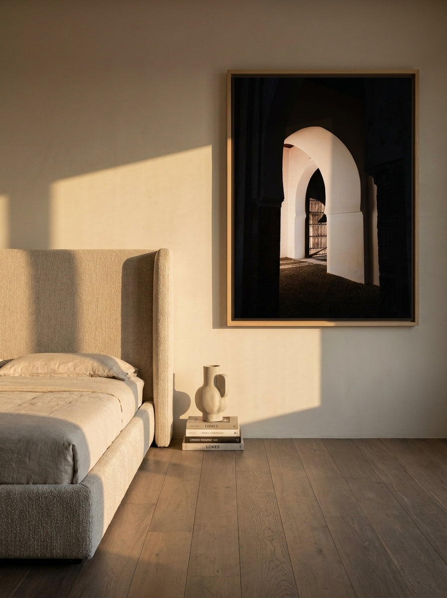 Oversized statement canvas wall art with a natural timber surround styled on the wall in a luxe bedroom