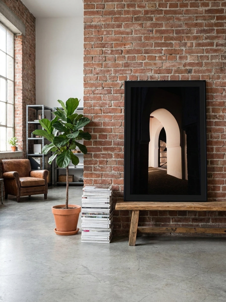 Modern wall art print standing on a bench in an industrial loft living room