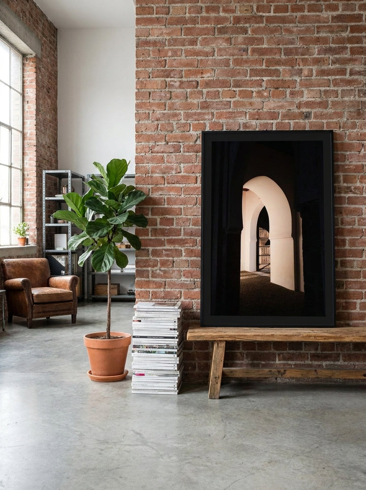 Modern wall art print standing on a bench in an industrial loft living room