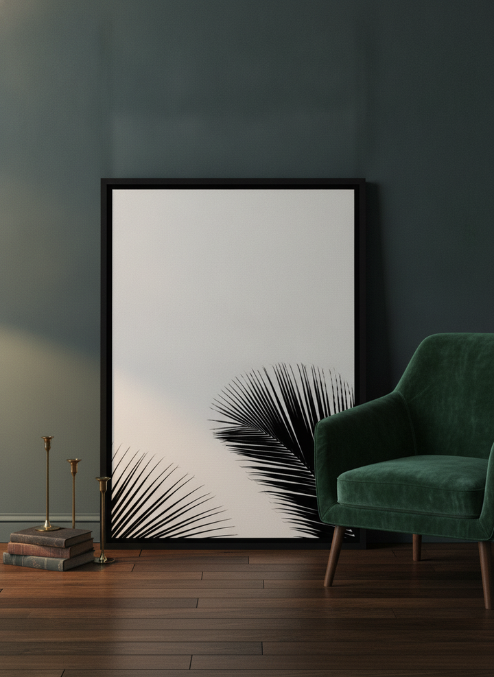 Canvas wall art with a black surround leaning against the wall in a moody home office