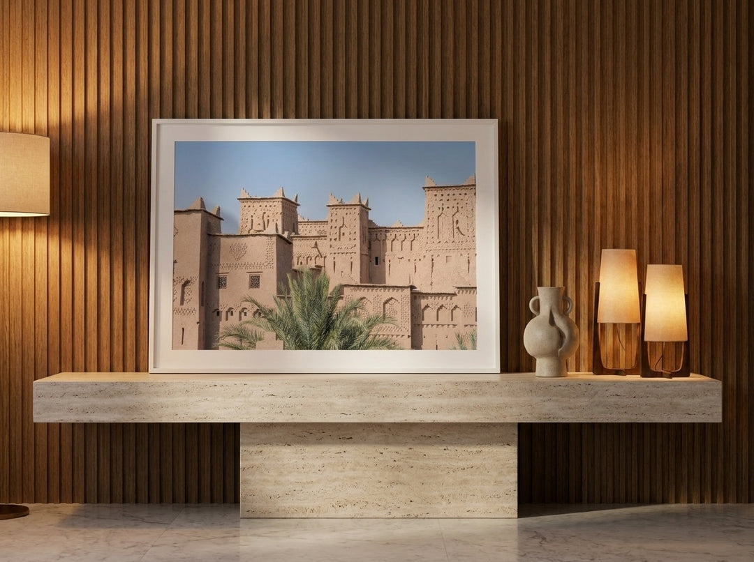 Modern wall art print standing on a console in a luxe bedroom