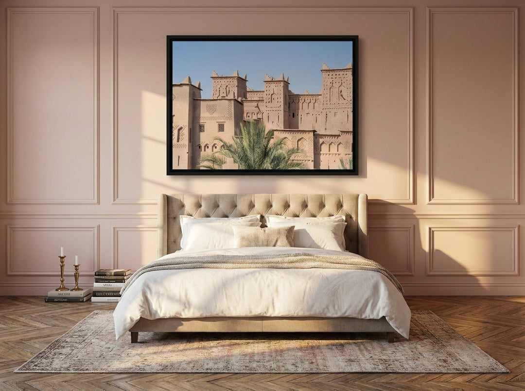 Canvas wall art with a black surround styled on the wall in a Parisian bedroom