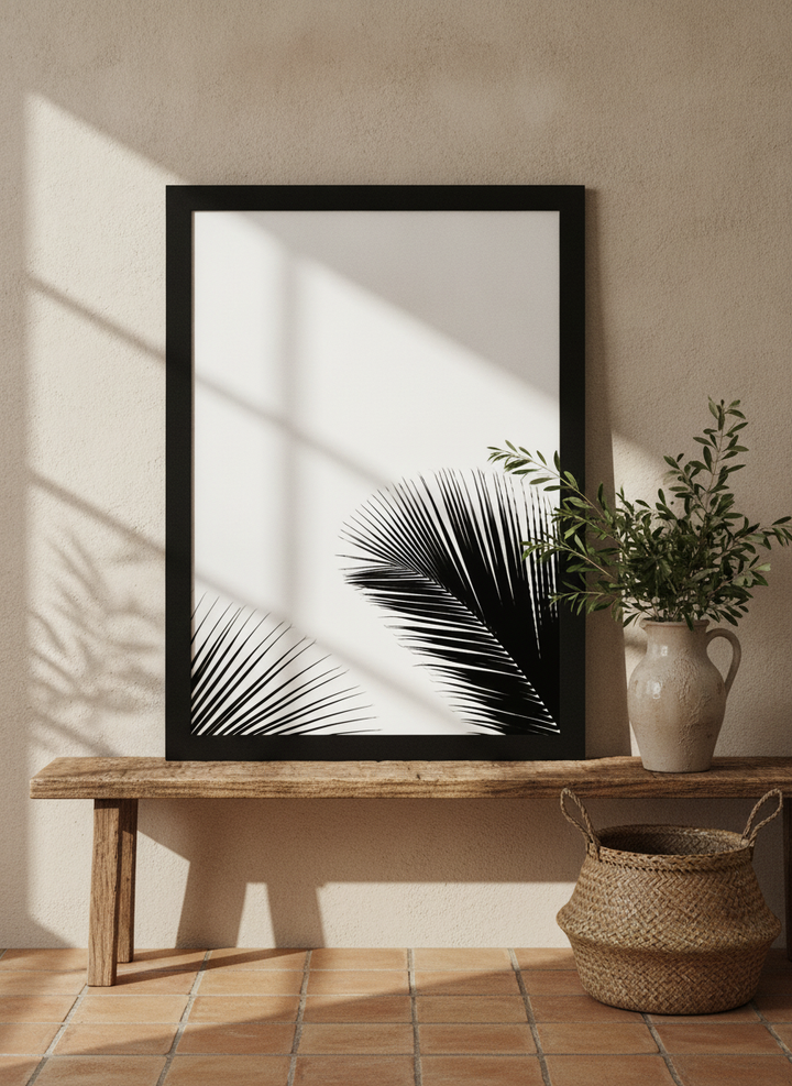 Modern wall art print standing on a bench in a Mediterranean bathroom