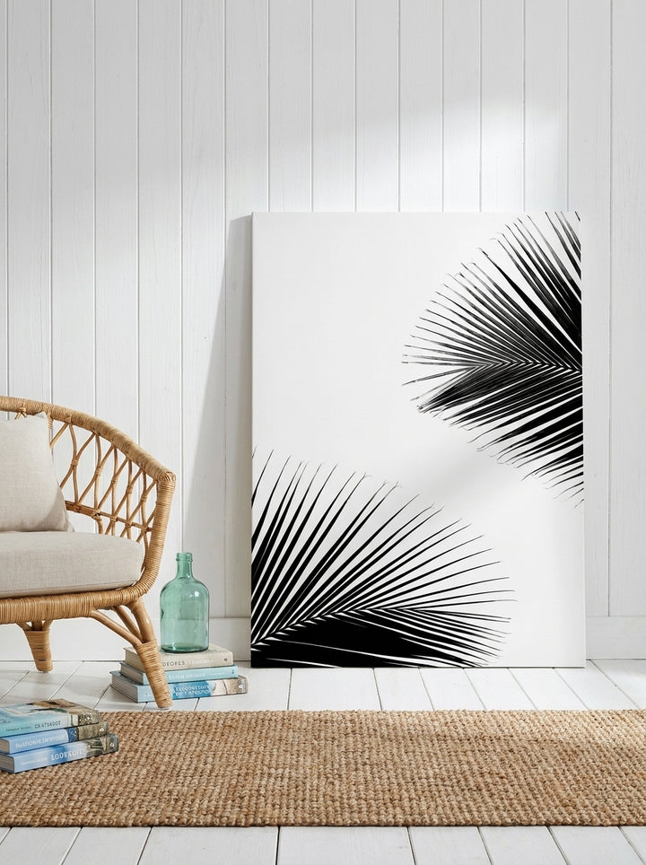 Stretched canvas wall art leaning against the wall in a coastal bedroom