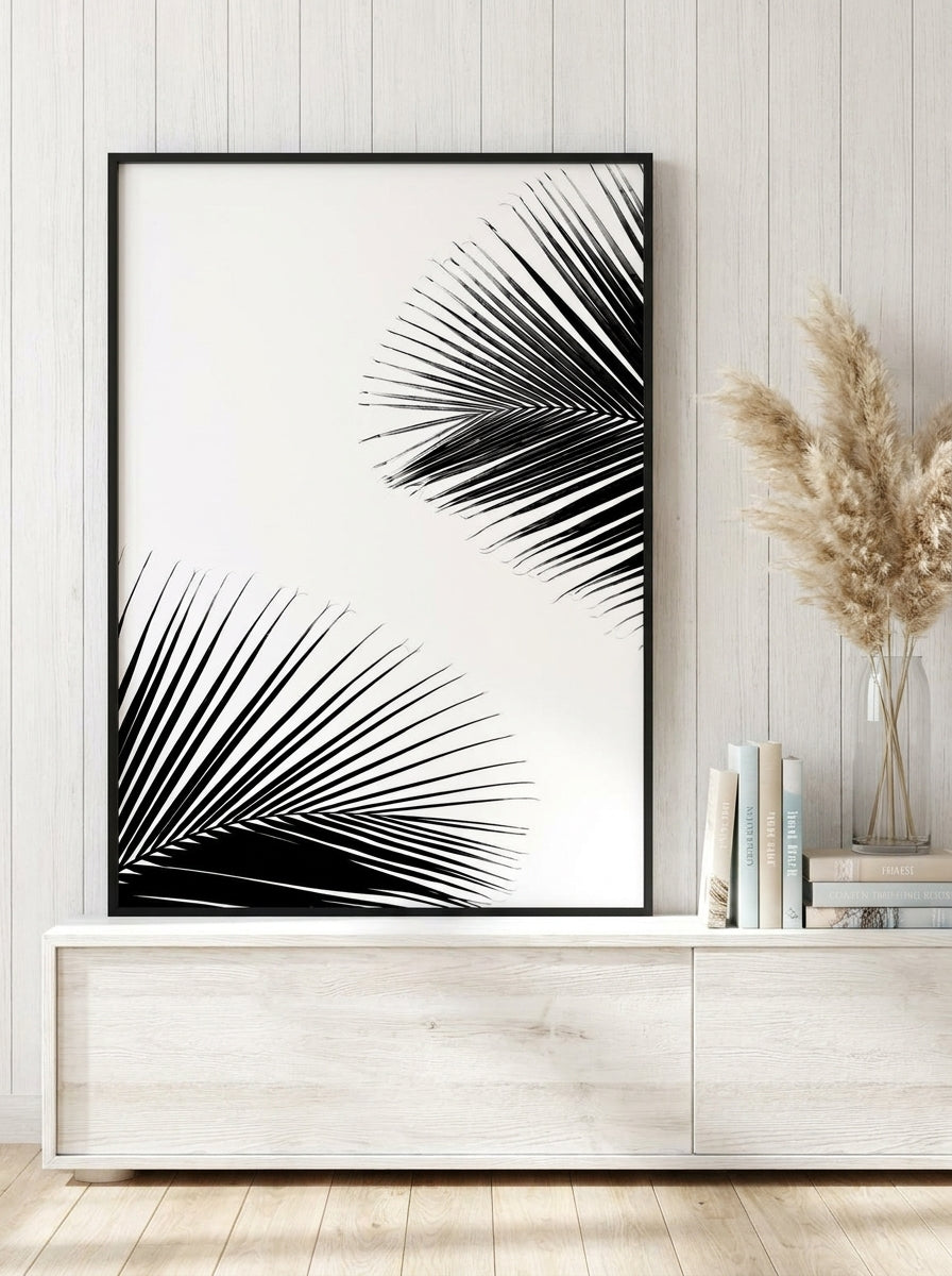 Modern wall art print standing on a console in a coastal bedroom