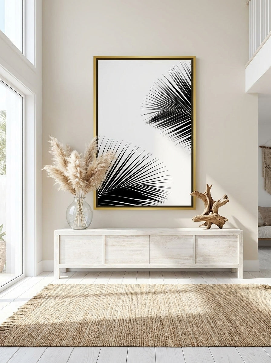 Oversized statement canvas wall art with a gold leaf surround styled on the wall in a coastal living room