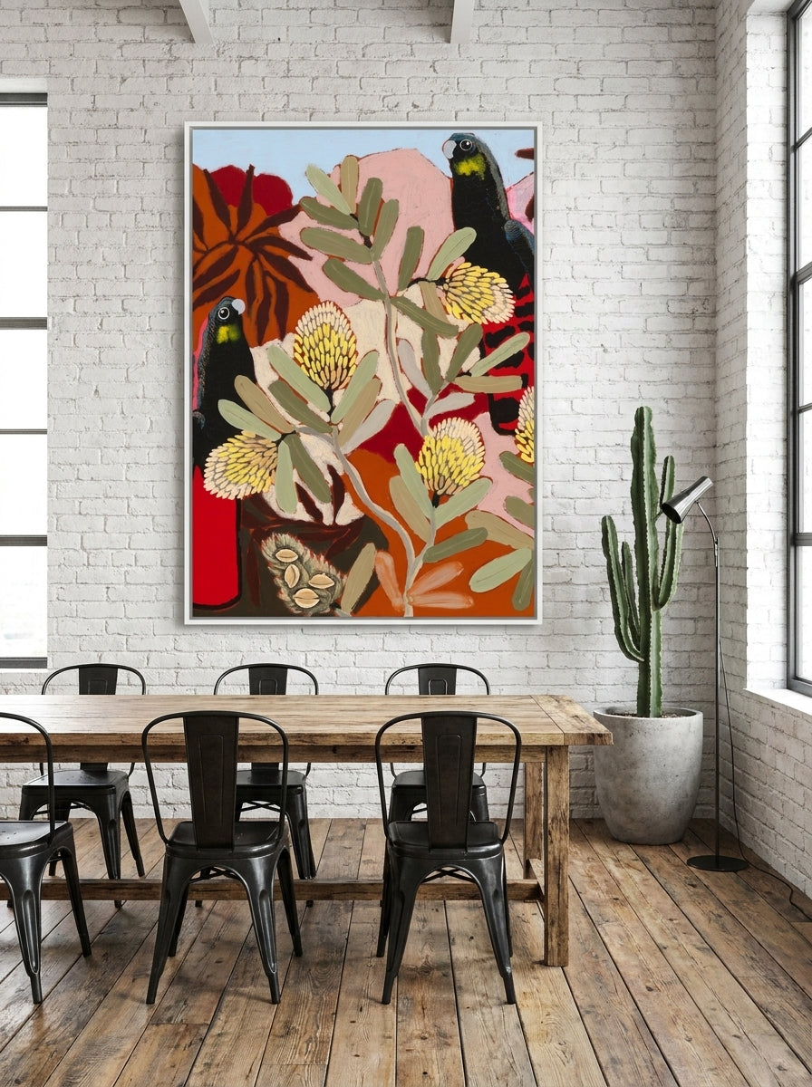 Oversized statement canvas wall art with a white surround styled on the wall in an industrial loft dining room