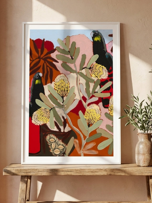 Modern wall art print standing on a bench in a Mediterranean bedroom