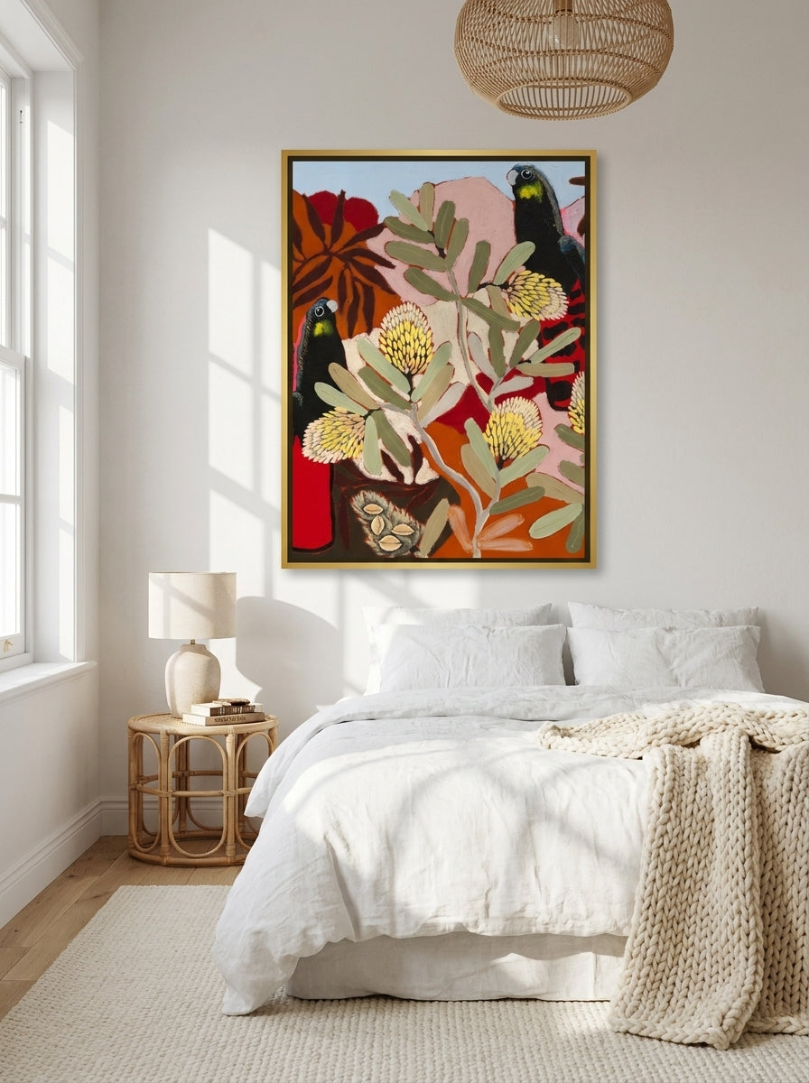 Canvas wall art with a gold leaf surround styled on the wall in a bright Scandinavian bedroom