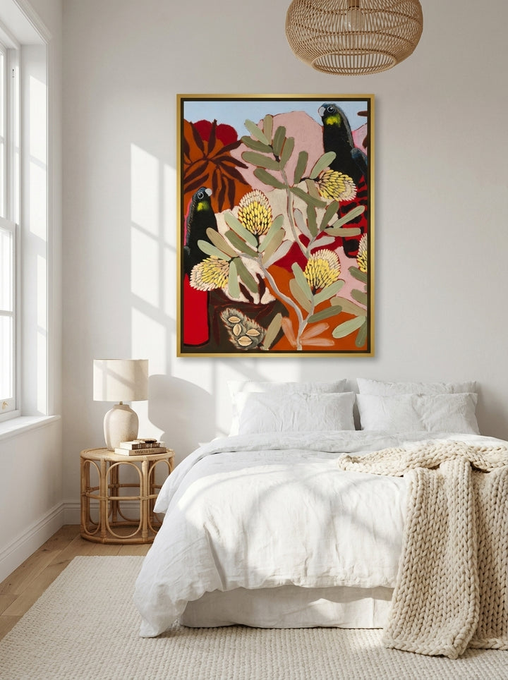 Canvas wall art with a gold leaf surround styled on the wall in a bright Scandinavian bedroom