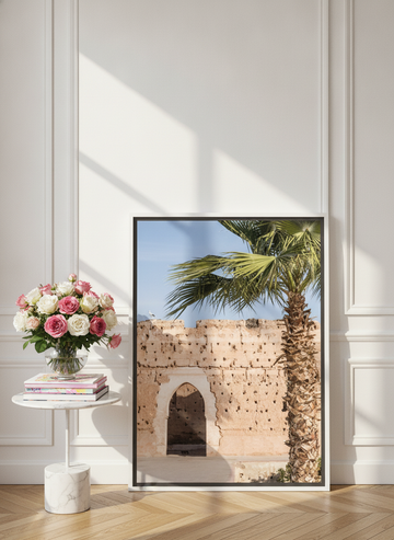 Canvas wall art with a white surround leaning against the wall in a Parisian home office