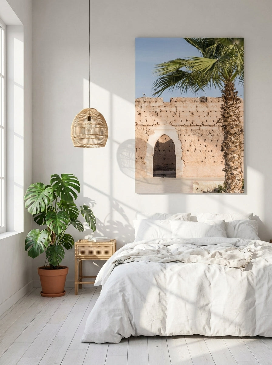 Stretched canvas wall art styled on the wall in a bright Scandinavian bedroom
