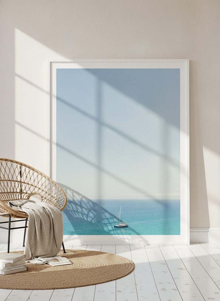 Modern wall art print leaning against the wall in a coastal bedroom