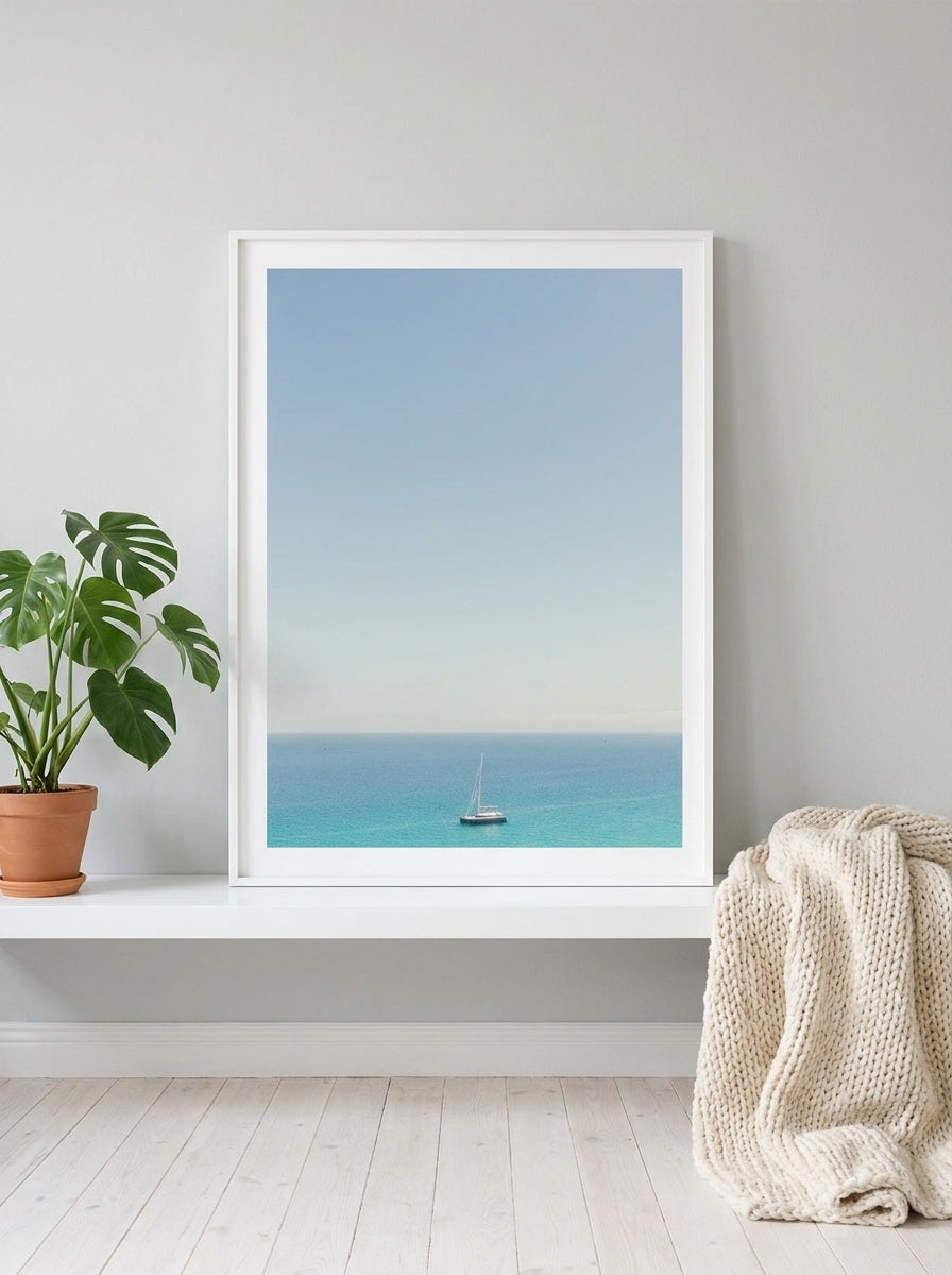Modern wall art print standing on a shelf in a bright Scandinavian bedroom