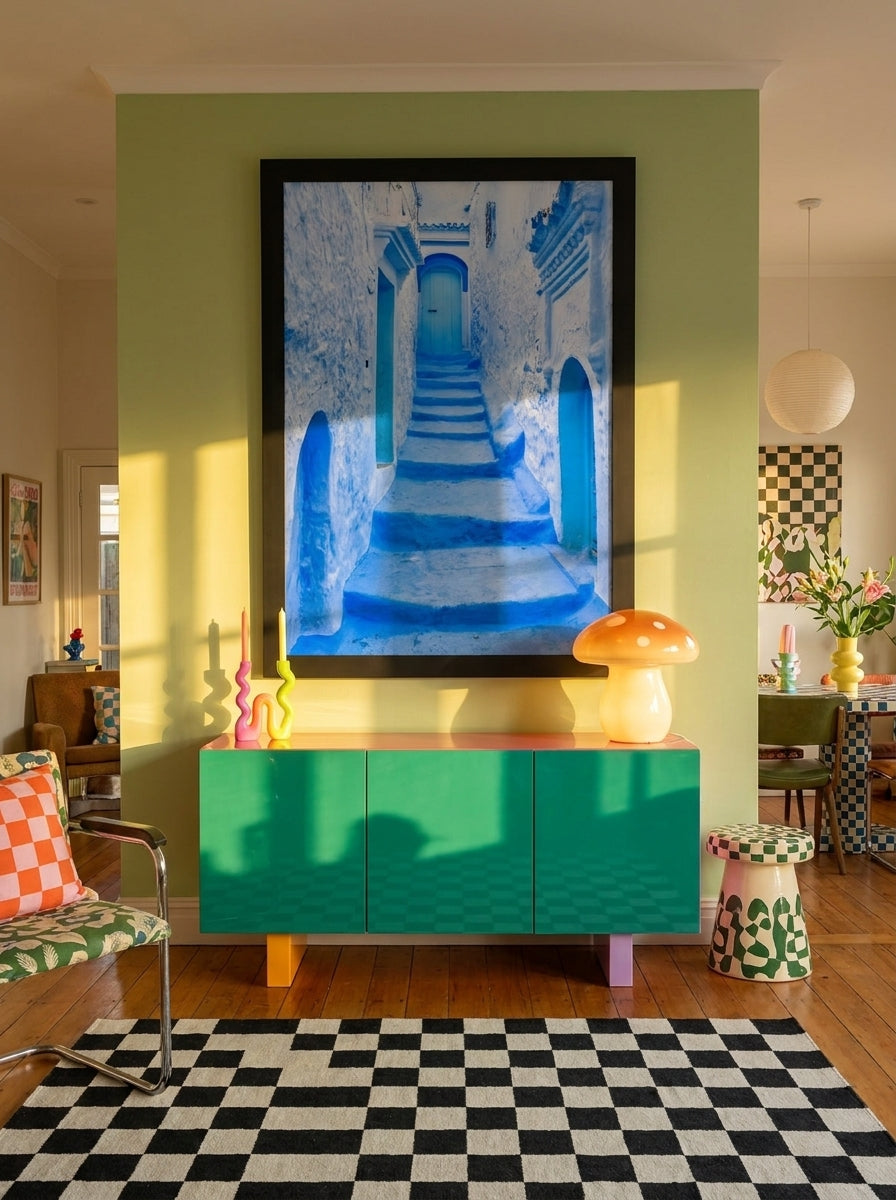 Oversized statement modern wall art print styled on the wall in a colourful eclectic living room