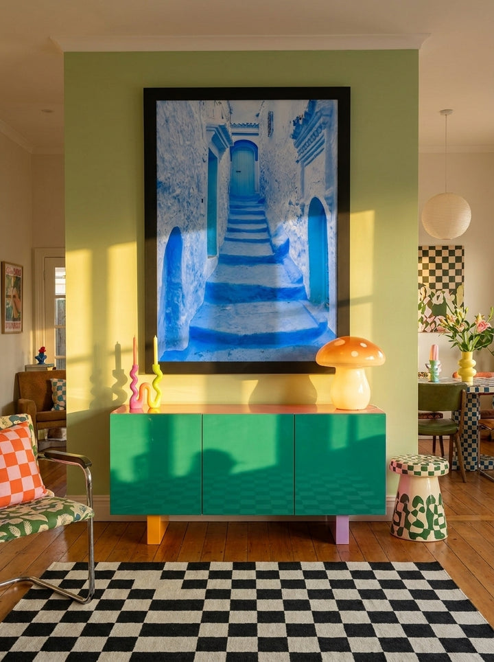 Oversized statement modern wall art print styled on the wall in a colourful eclectic living room