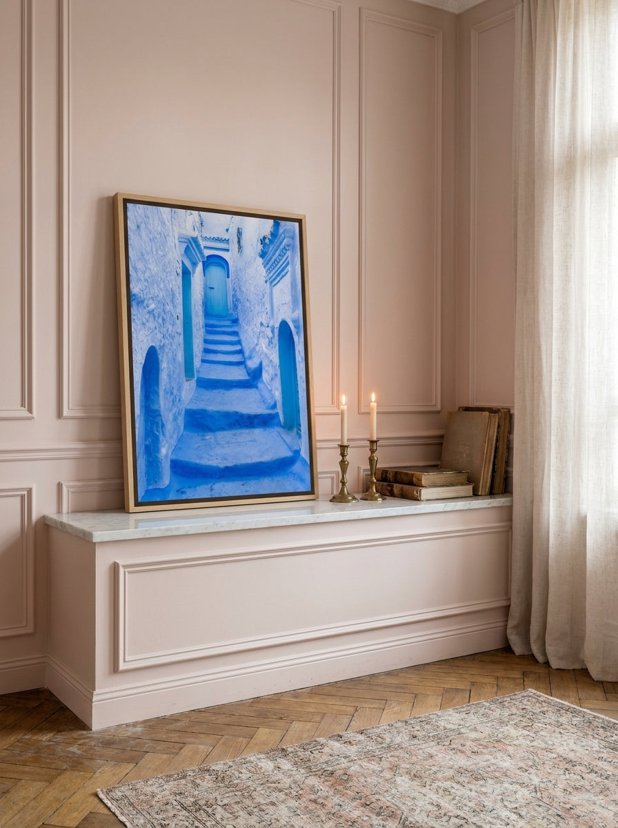 Canvas wall art with a natural timber surround standing on a console in a Parisian bathroom