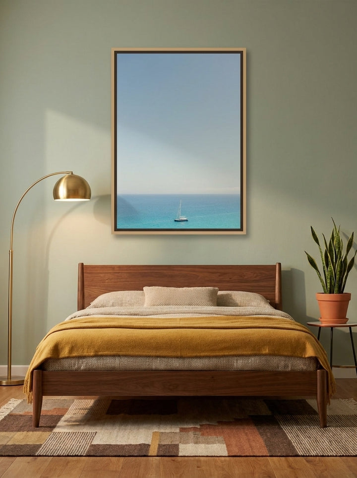 Canvas wall art with a natural timber surround styled on the wall in a mid-century bedroom