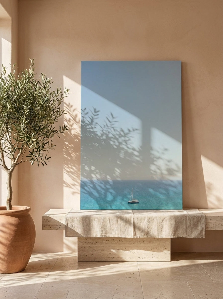 Stretched canvas wall art standing on a console in a Mediterranean living room
