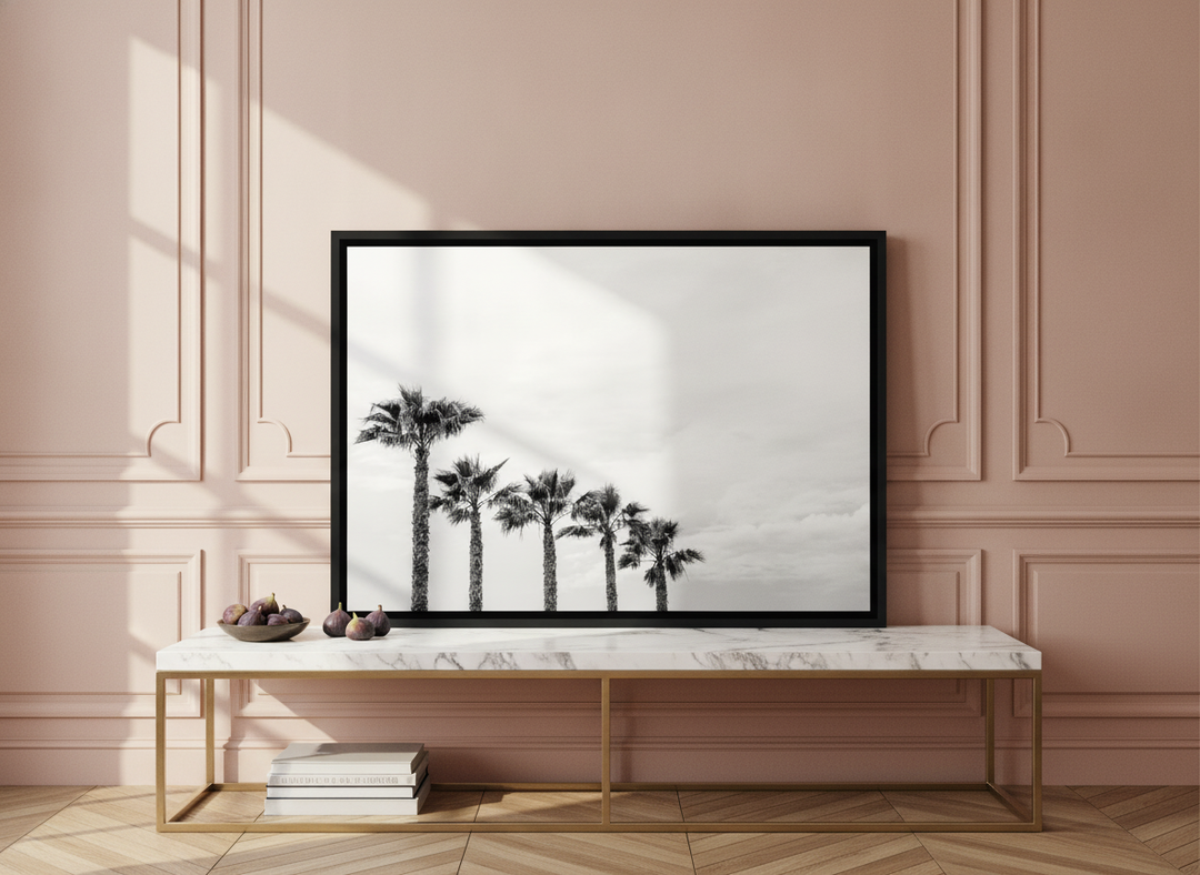 Canvas wall art with a black surround standing on a console in a Parisian living room
