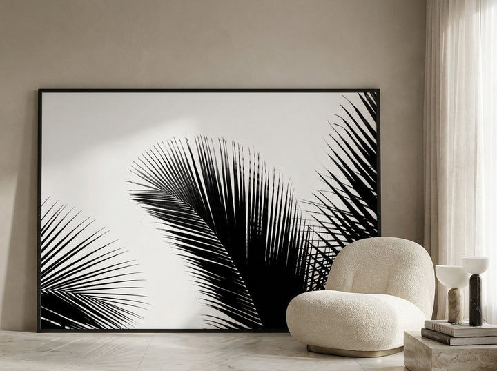 Oversized statement modern wall art print leaning against the wall in a luxe living room