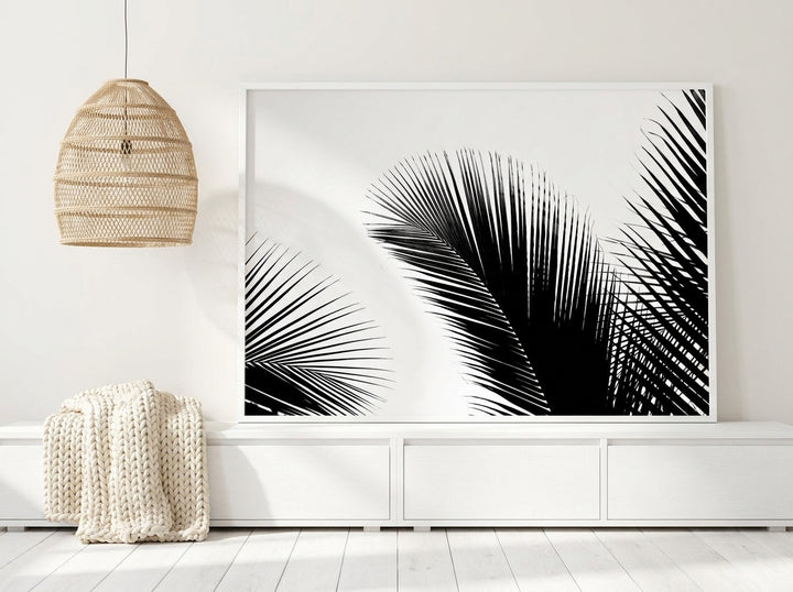 Modern wall art print standing on a sideboard in a bright Scandinavian bathroom