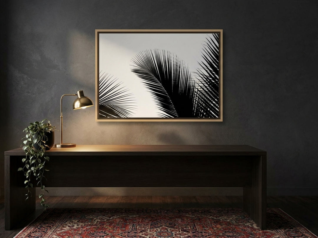 Canvas wall art with a natural timber surround styled on the wall in a moody home office