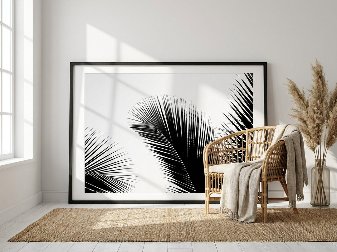 Oversized statement modern wall art print leaning against the wall in a coastal bedroom