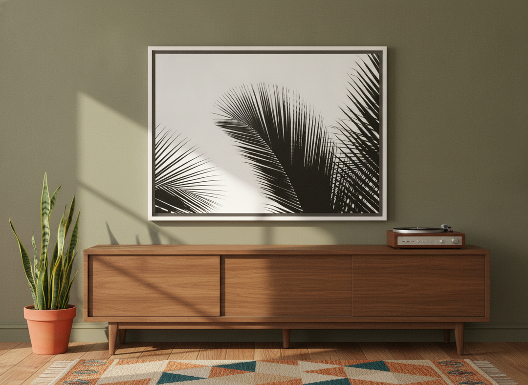 Canvas wall art with a white surround standing on a sideboard in a mid-century bedroom