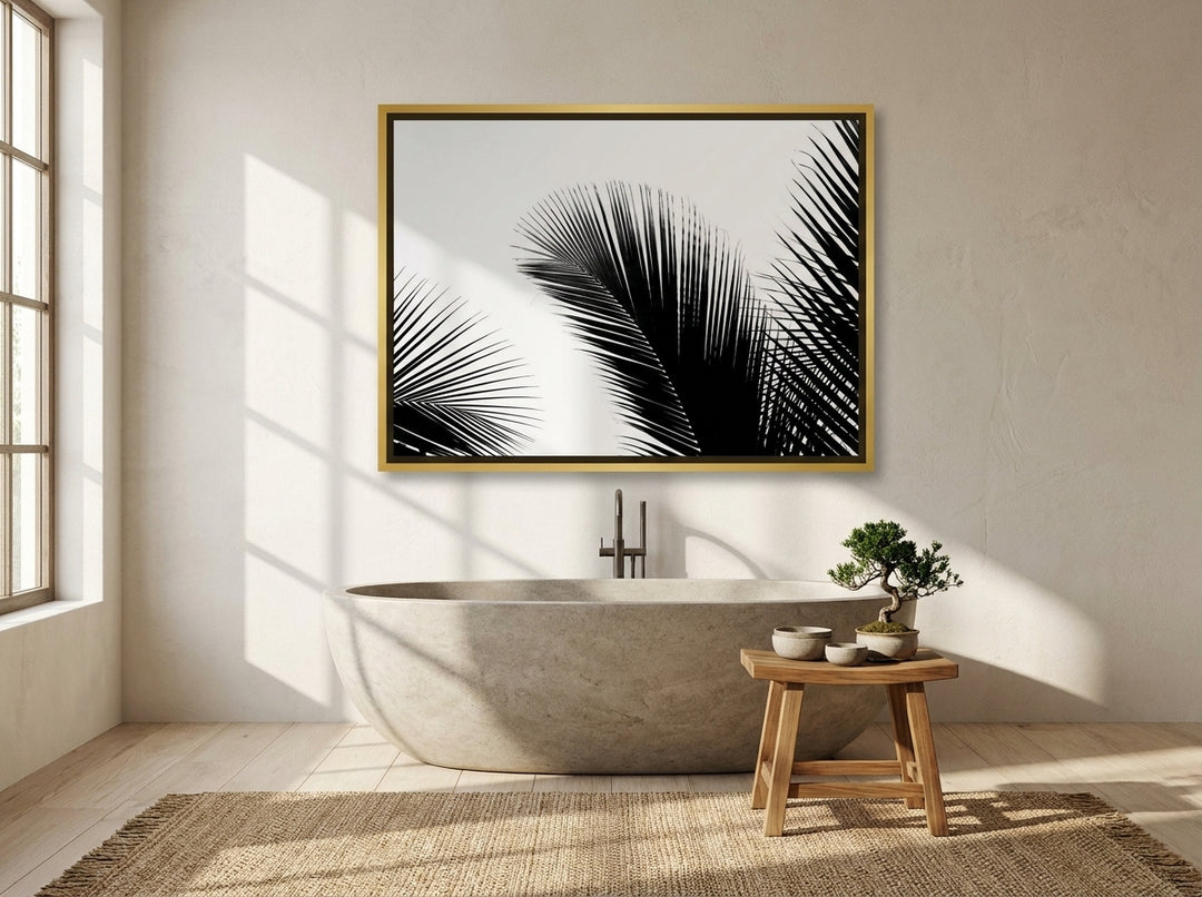 Oversized statement canvas wall art with a gold leaf surround styled on the wall in a warm Japandi bathroom