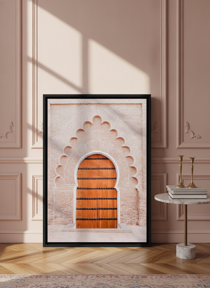 Canvas wall art with a black surround leaning against the wall in a Parisian living room