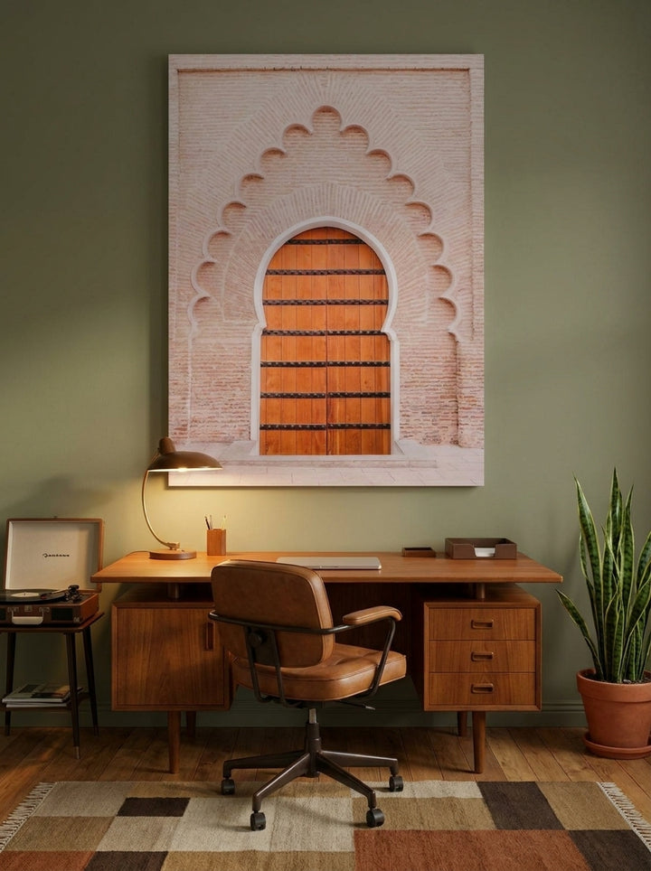 Stretched canvas wall art styled on the wall in a mid-century home office