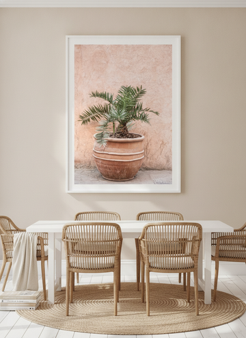Oversized statement modern wall art print styled on the wall in a coastal dining room