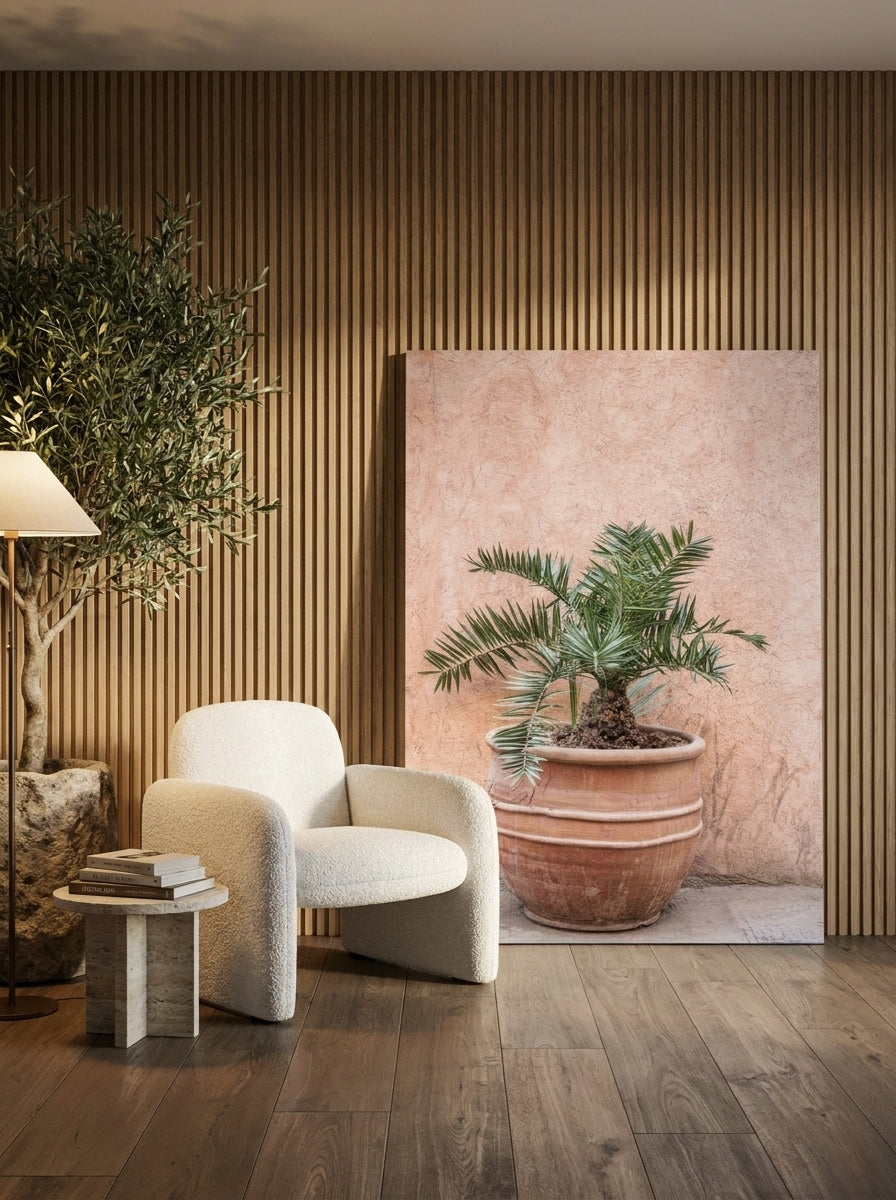 Stretched canvas wall art leaning against the wall in a luxe bedroom