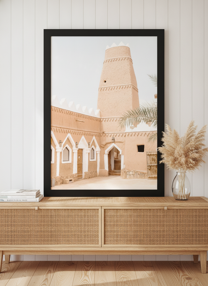 Modern wall art print standing on a sideboard in a coastal living room