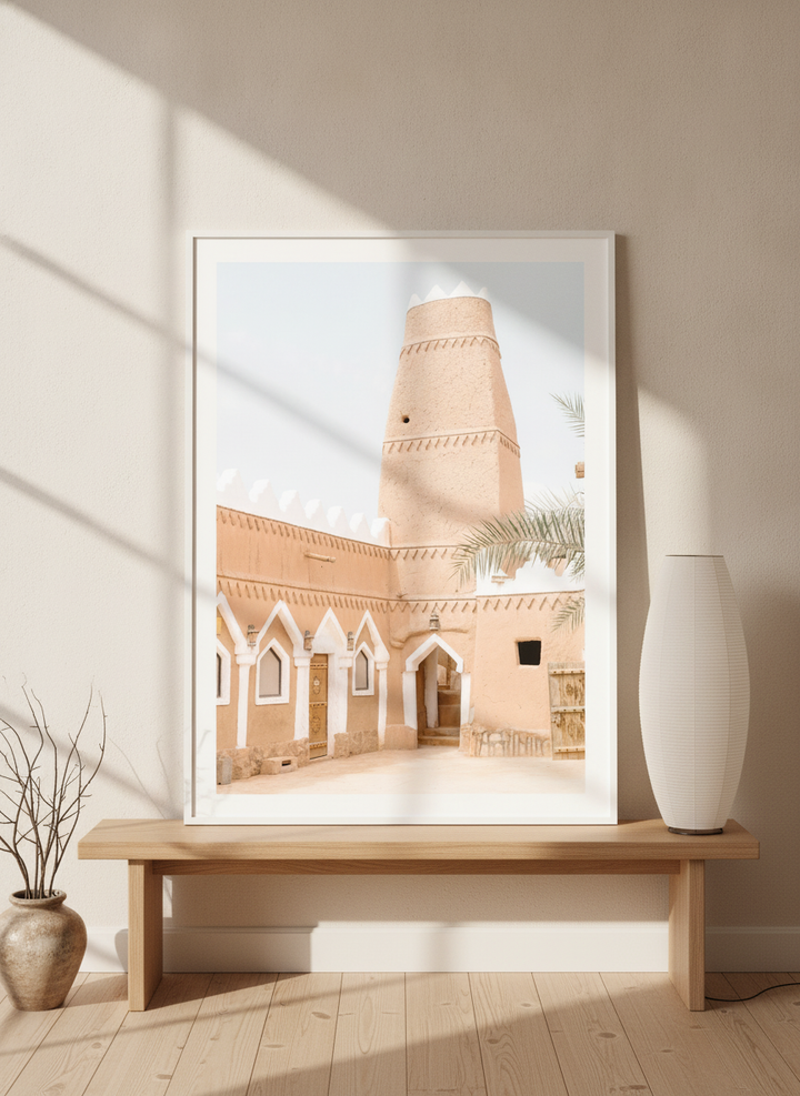 Modern wall art print standing on a bench in a warm Japandi bedroom