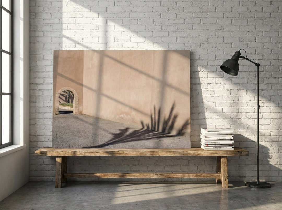 Stretched canvas wall art standing on a bench in an industrial loft home office
