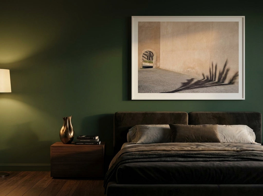 Modern wall art print styled on the wall in a moody bedroom