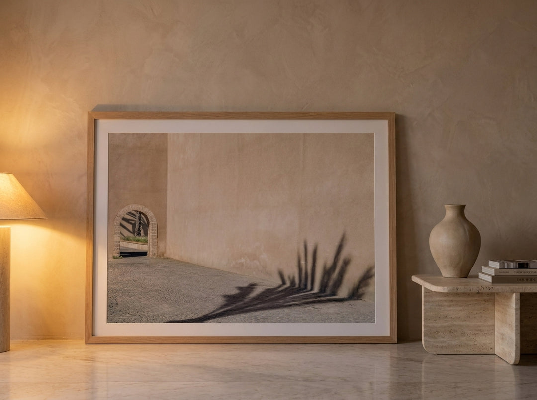 Oversized statement modern wall art print leaning against the wall in a luxe bedroom