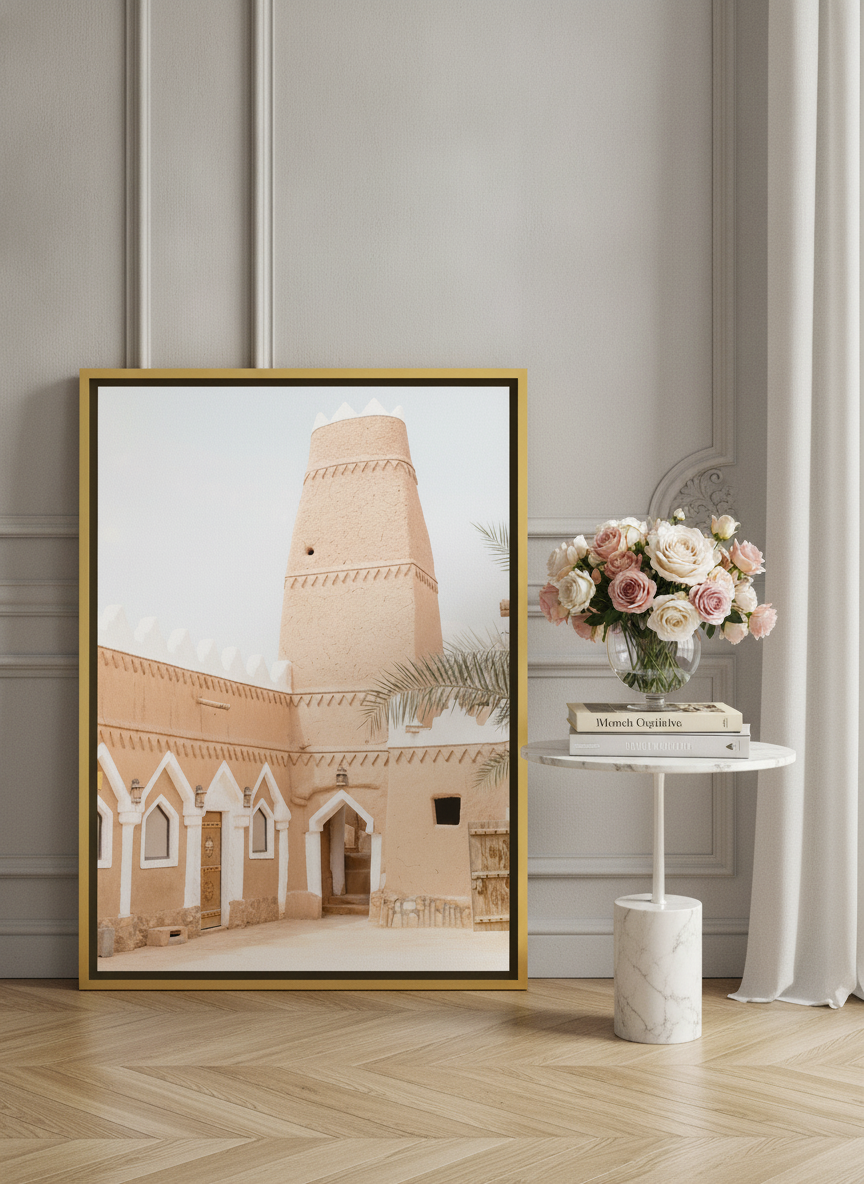 Canvas wall art with a gold leaf surround leaning against the wall in a Parisian bedroom