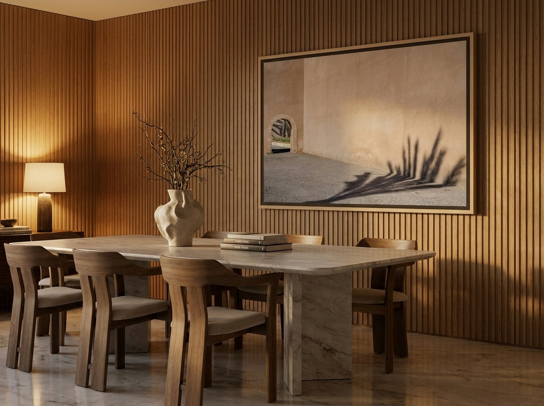 Oversized statement canvas wall art with a natural timber surround styled on the wall in a luxe dining room