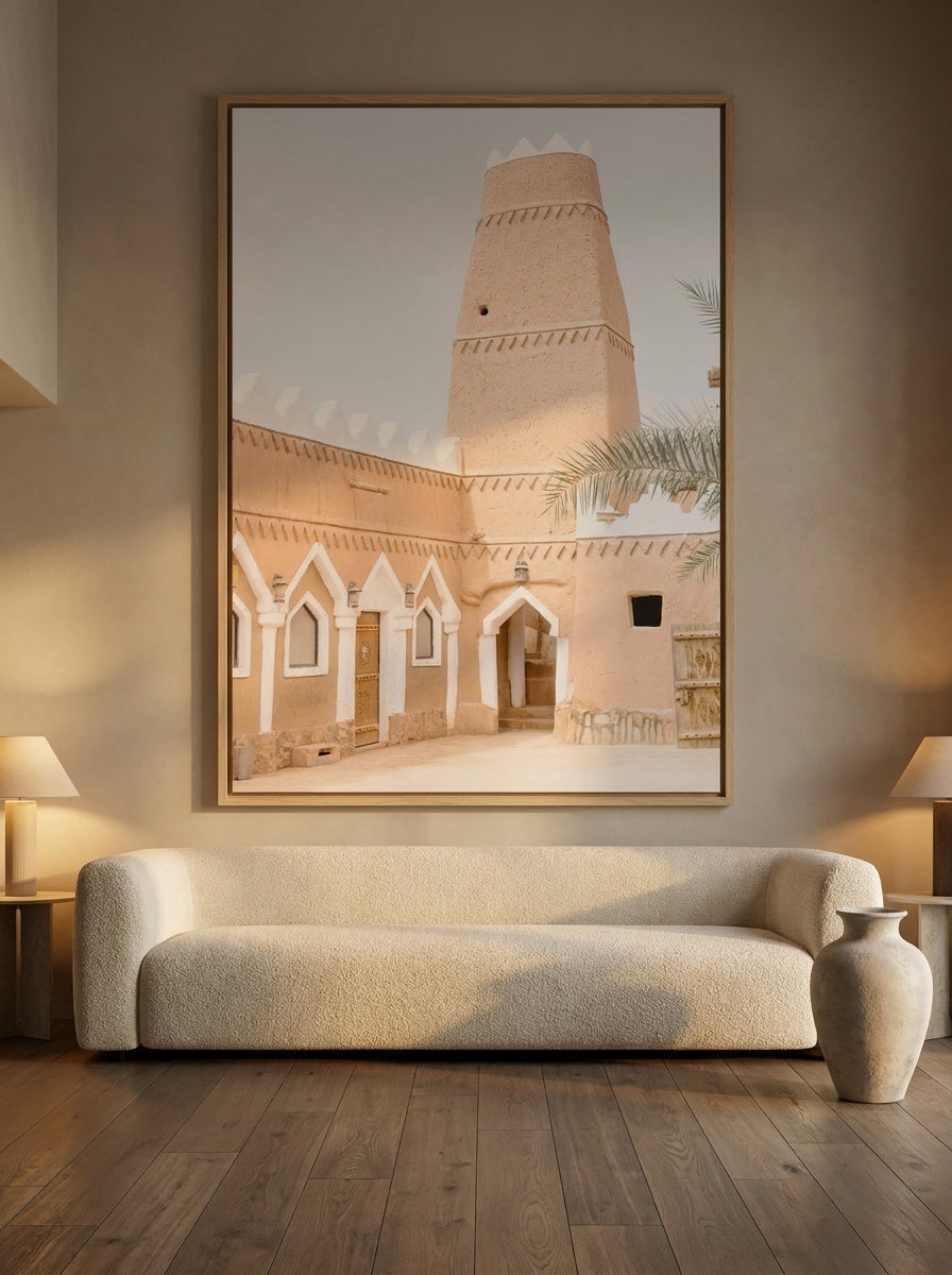 Oversized statement canvas wall art with a natural timber surround styled on the wall in a luxe living room