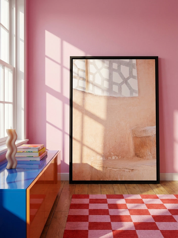 Canvas wall art with a black surround standing on a sideboard in a colourful eclectic bedroom