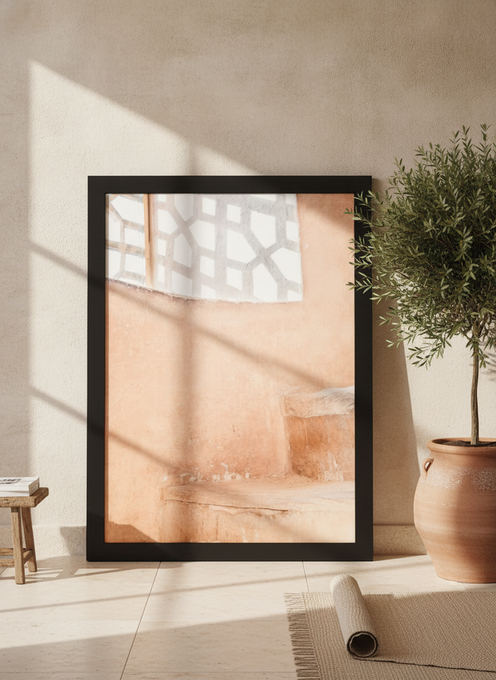 Oversized statement modern wall art print leaning against the wall in a Mediterranean living room
