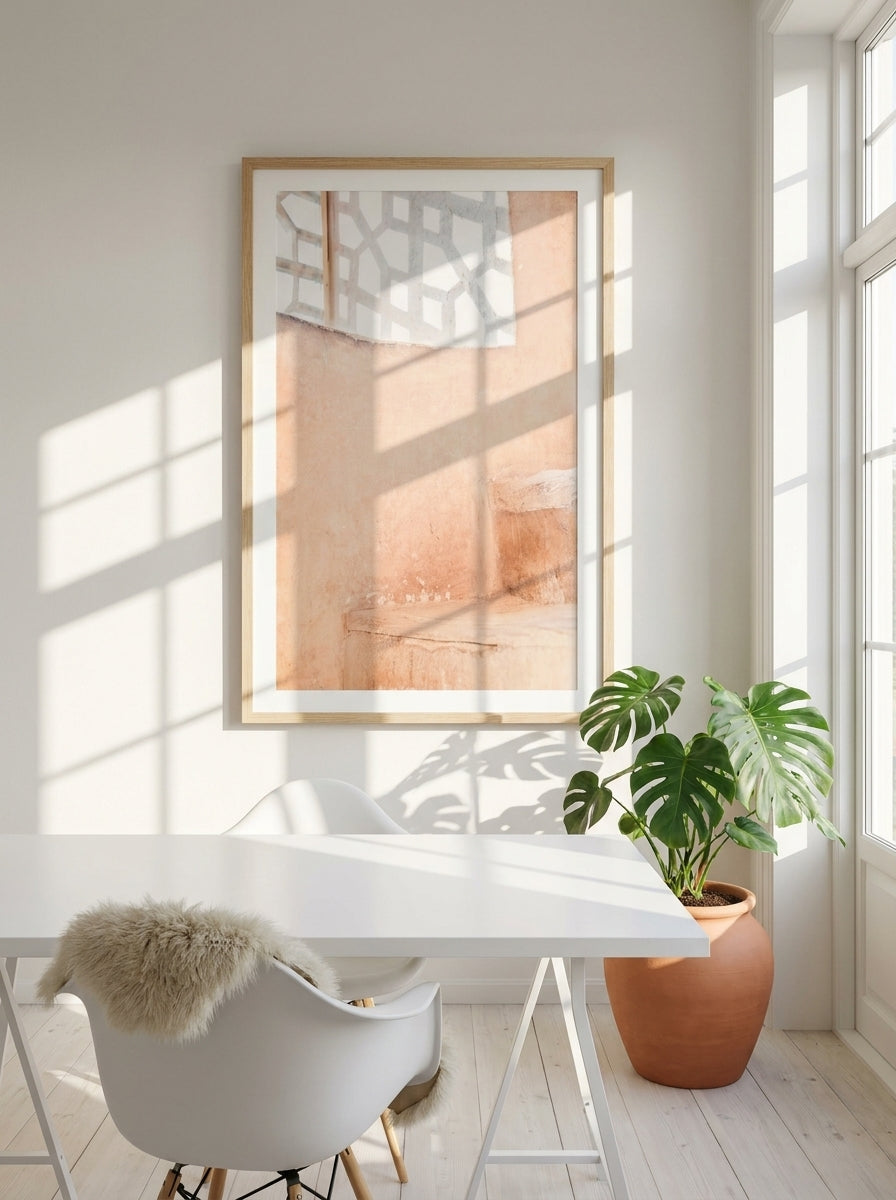 Modern wall art print styled on the wall in a bright Scandinavian home office